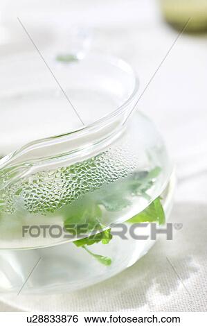 Jug of herbal tea View Large Photo Image Stock Photograph - Jug of herbal tea. Fotosearch