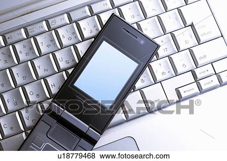 Keyboard and mobile phone View Large Photo Image Stock Photo - Keyboard and mobile phone. Fotosearch