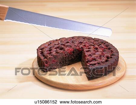 Knife about to cut into a chocolate cake View Large Photo Image Stock Image - Knife about to cut into a chocolate cake. Fotosearch