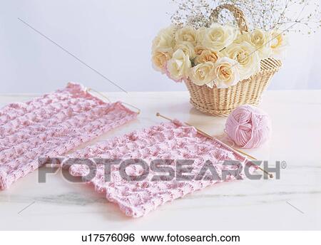 Stock Photograph - Knitting and a basket of roses. Fotosearch