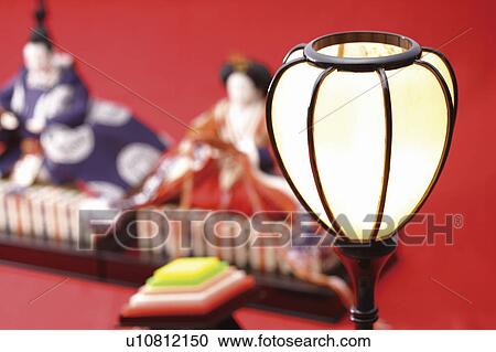 Stock Image - Lamp and emperor dolls for the Japanese Doll Festival. Fotosearch
