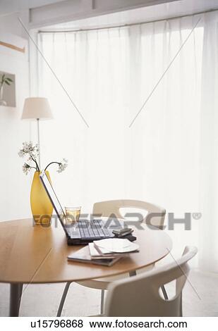 Laptop on table in house View Large Photo Image Stock Photo - Laptop on table in house. Fotosearch