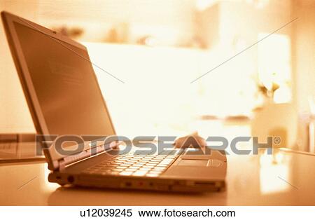 Laptop on table in house View Large Photo Image Stock Photography - Laptop on table in house. Fotosearch