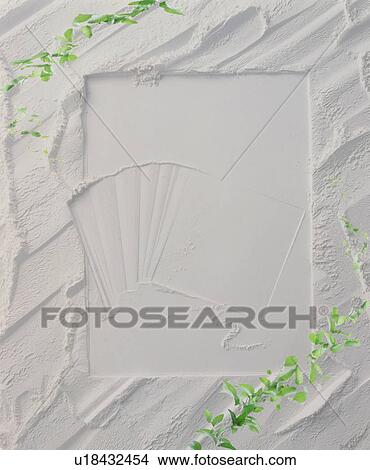Leaves growing around a textured white frame View Large Photo Image Picture - Leaves growing around a textured white frame. Fotosearch
