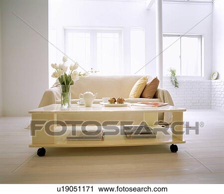 Living room with sofa and coffee table View Large Photo Image Stock Image - Living room with sofa and coffee table. Fotosearch