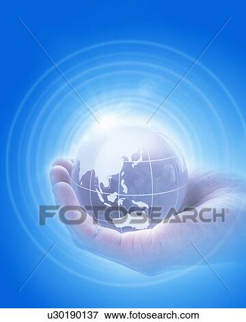 Stock Photo - Man holding globe and sunbeam. Fotosearch
