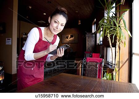 Mid Adult Woman Taking Orders at Table View Large Photo Image Stock Image - Mid Adult Woman Taking Orders at Table. Fotosearch