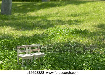 Miniature wooden chairs in a forest clearing View Large Photo Image Stock Photo - Miniature wooden chairs in a forest clearing. Fotosearch