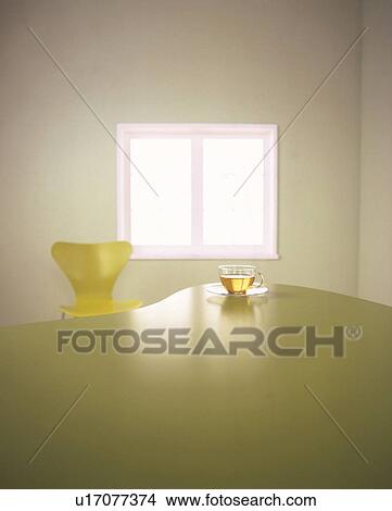 Modern yellow chair and table with a cup of tea View Large Photo Image Picture - Modern yellow chair and table with a cup of tea. Fotosearch