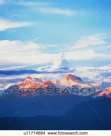 Mountain range capped with snow View Large Photo Image Picture - Mountain range capped with snow. Fotosearch