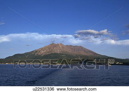 Stock Photograph - Mountains above sea, Sakurajima, Kagoshima, Kagoshima Prefecture, Japan. Fotosearch