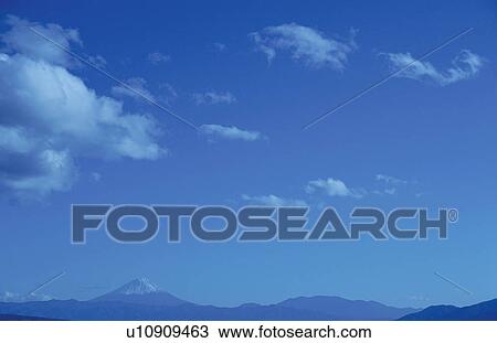 Stock Image - Mt. Fuji against blue sky. Mt Yatsugatake, Yamanashi Prefecture, Japan. Fotosearch