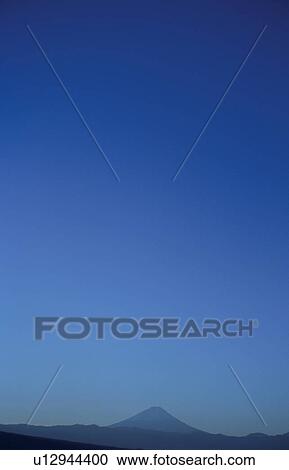 Stock Image - Mt. Fuji against blue sky. Mt Yatsugatake, Yamanashi Prefecture, Japan. Fotosearch