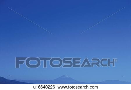 Stock Photograph - Mt. Fuji against blue sky. Mt Yatsugatake, Yamanashi Prefecture, Japan. Fotosearch