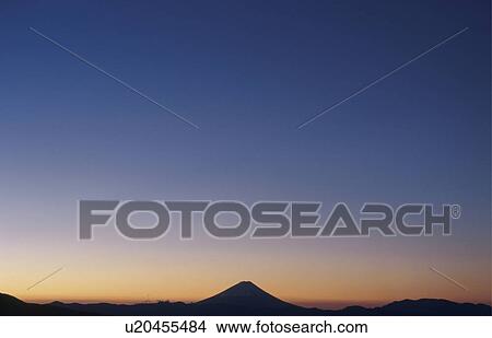 Picture - Mt Fuji at sunset in distance. Mt Yatsugatake, Yamanashi Prefecture, Japan. Fotosearch