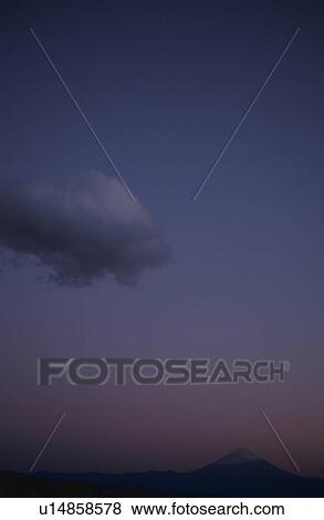 Stock Photo - Mt Fuji at sunset in distance. Mt Yatsugatake, Yamanashi Prefecture, Japan. Fotosearch