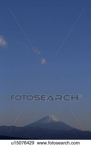 Stock Photo - Mt Fuji at sunset in distance. Mt Yatsugatake, Yamanashi Prefecture, Japan. Fotosearch