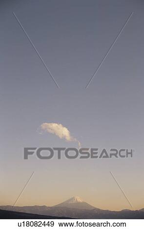 Stock Photo - Mt Fuji at sunset in distance. Mt Yatsugatake, Yamanashi Prefecture, Japan. Fotosearch