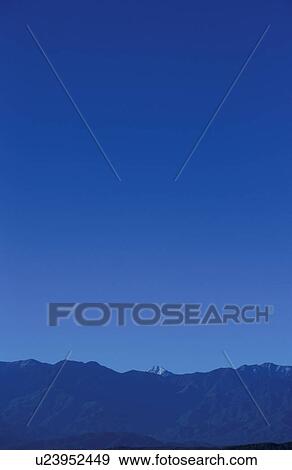 Mt Fuji peeking from behind mountain range. Mt Yatsugatake, Yamanashi Prefecture, Japan View Large Photo Image Stock Photo - Mt Fuji peeking from behind mountain range. Mt Yatsugatake, Yamanashi Prefecture, Japan. Fotosearch
