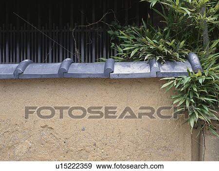 Stock Photo - Mud wall and tiles, Kyoto, Japan. Fotosearch
