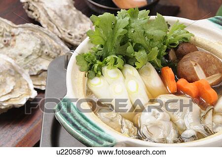 Stock Image - Nabe dish with oysters and vegetables. Fotosearch