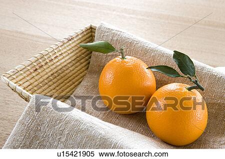 Stock Photography - Navel oranges in a basket. Fotosearch