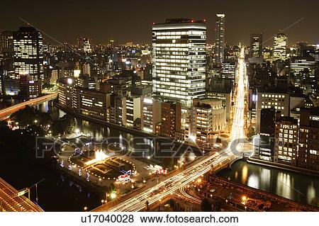 Stock Photo - Nighttime Osaka cityscape, Osaka, Japan. Fotosearch