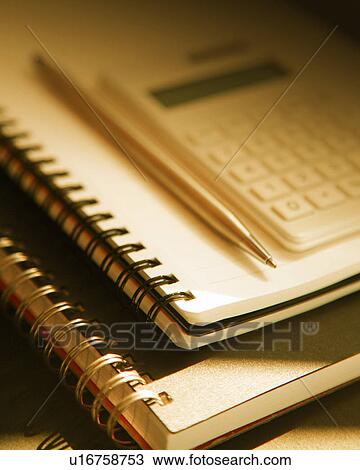 Stock Image - Notebooks, pen and a calculator. Fotosearch