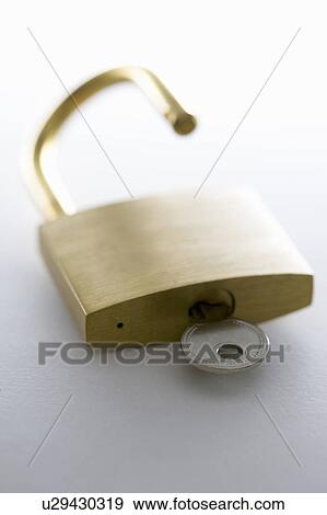 Stock Photo - Open padlock with key. Fotosearch