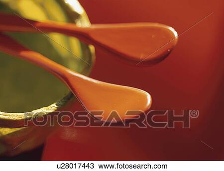 Orange spoons in bowl View Large Photo Image Stock Image - Orange spoons in bowl. Fotosearch