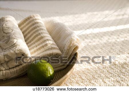 Organic cotton towels in a basket with a lamp View Large Photo Image Stock Photograph - Organic cotton towels in a basket with a lamp. Fotosearch