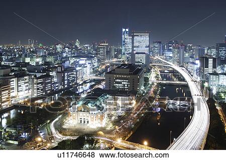 Stock Photo - Osaka cityscape at night, Japan. Fotosearch