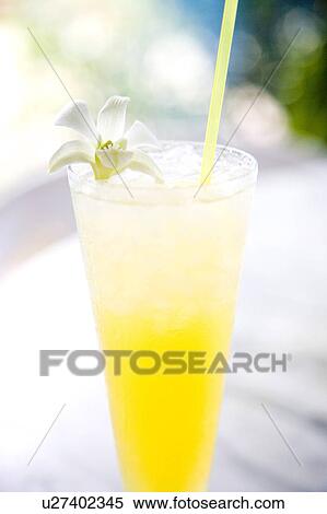 Stock Photography - Passionfruit juice in glass, Ishigaki Island, Okinawa Prefecture, Japan. Fotosearch