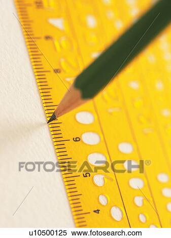 Stock Photography - Pencil drawing a line with a ruler. Fotosearch