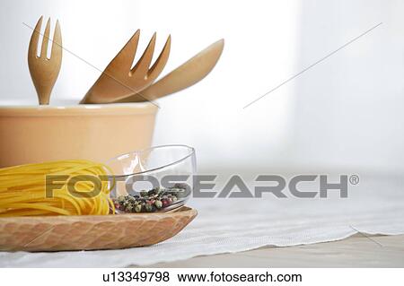 Peppercorns, pasta and bowl on table View Large Photo Image Stock Photo - Peppercorns, pasta and bowl on table. Fotosearch