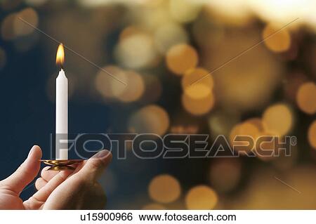 Person holding a candle View Large Photo Image Stock Photograph - Person holding a candle. Fotosearch