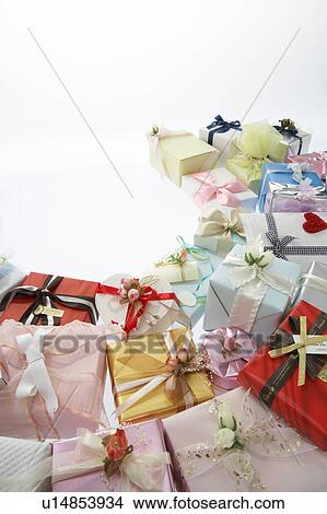 Pile of giftwrapped presents. View Large Photo Image Picture - Pile of giftwrapped presents.. Fotosearch