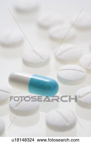 Pills and a capsule. View Large Photo Image Picture - Pills and a capsule.. Fotosearch