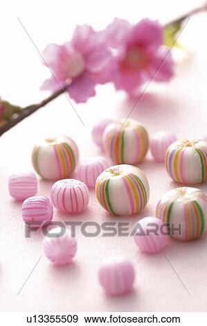 Stock Photo - Pink flower and sweets. Fotosearch