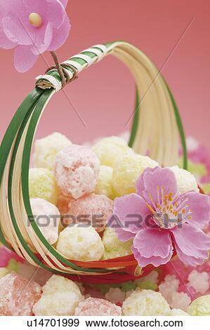 Stock Photo - Pink flower with Japanese sweets. Fotosearch