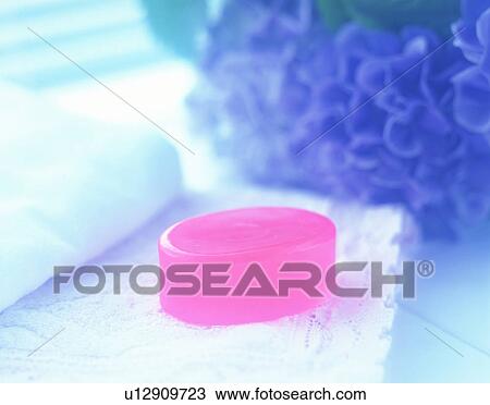 Stock Image - Pink soap, towel and hydrangea. Fotosearch