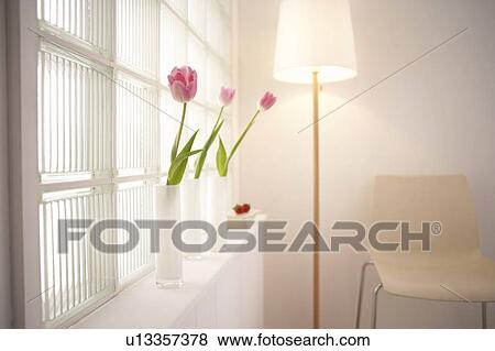 Pink tulips in vases on a window sill View Large Photo Image Stock Photo - Pink tulips in vases on a window sill. Fotosearch