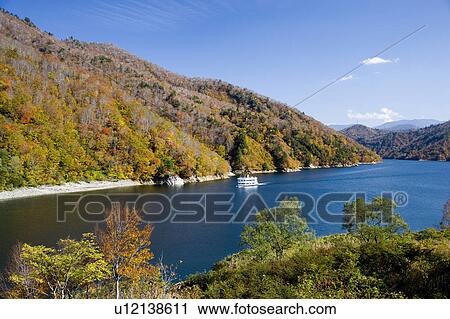 Stock Image - Pleasure boat on Okutadami Lake, Uonuma, Niigata Prefecture, Japan. Fotosearch