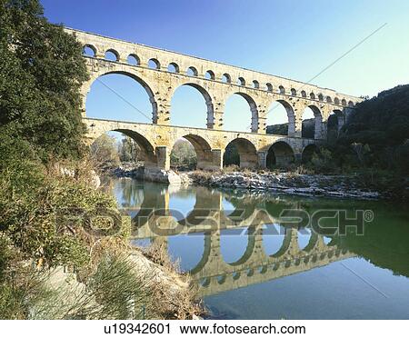 Stock Image - Pont du Gard and River Gard, Provence, France. Fotosearch