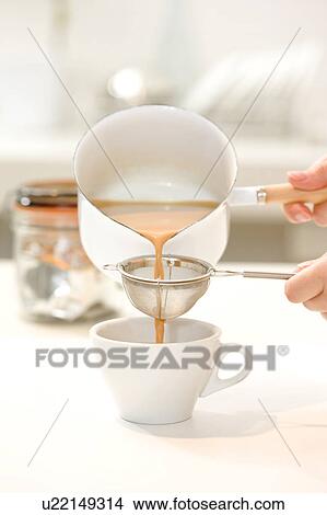 Pouring chai tea View Large Photo Image Picture - Pouring chai tea. Fotosearch