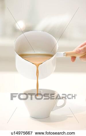 Pouring chai tea View Large Photo Image Stock Photo - Pouring chai tea. Fotosearch