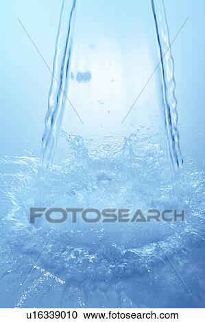 Pouring water, blue background View Large Photo Image Stock Image - Pouring water, blue background. Fotosearch