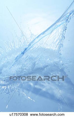 Stock Photo - Pouring water, blue background. Fotosearch