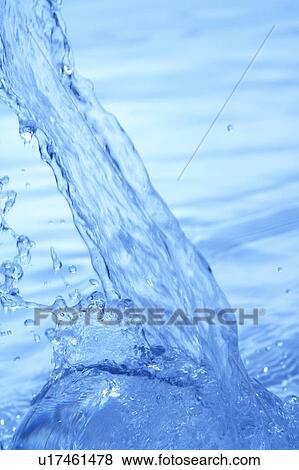 Pouring water, close up, blue background View Large Photo Image Stock Photo - Pouring water, close up, blue background. Fotosearch