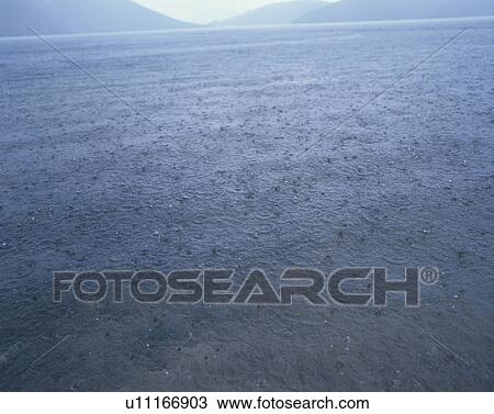 Stock Image - Rain over a lake. Tochigi Prefecture, Japan. Fotosearch